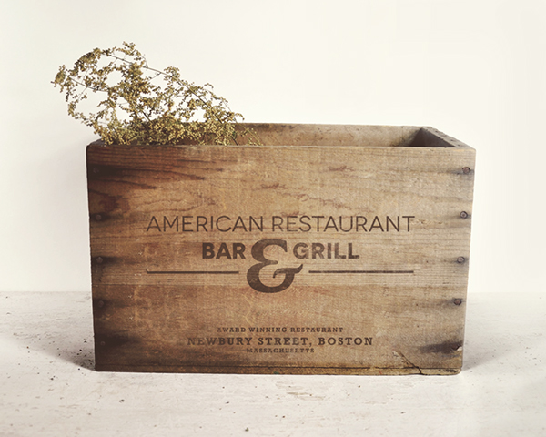 Wooden box with American Restaurant logo.