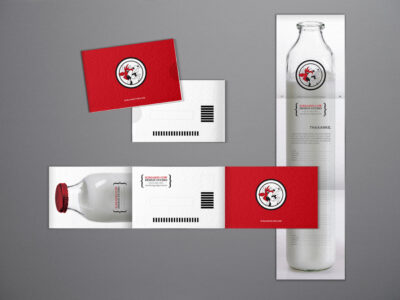 Screamin Cow branding design on milk bottle and cards.